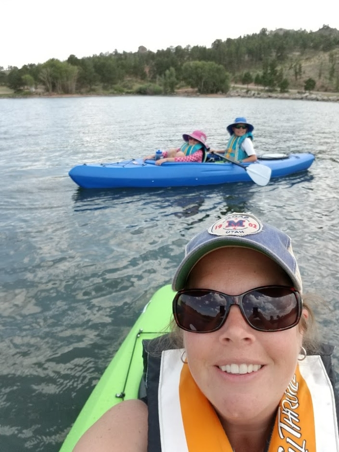 Laura Olson kayaking with family members
