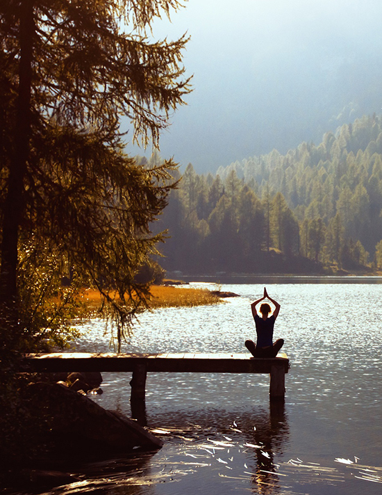 Meditation by a mountainside lake