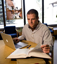 Student studying in the library at the University of Wyoming College of Law