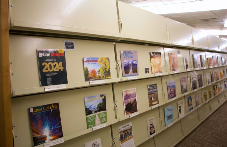 A shelf of magazine in the magazine collection at Coe library.