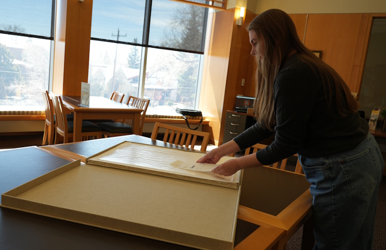 Amanda Bugbee processing the book donation in Special Collections