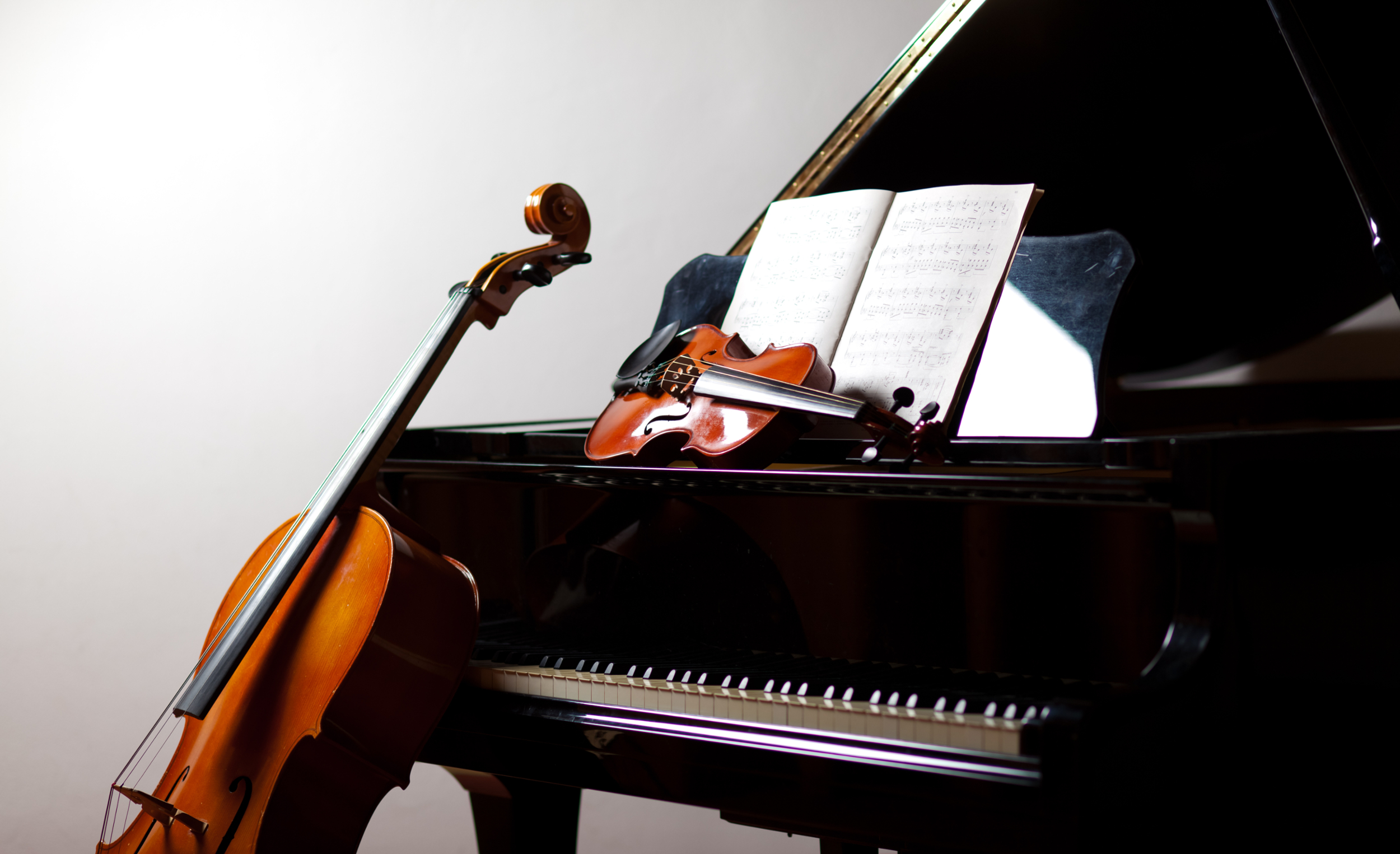 Photo of a violin, cello, and piano