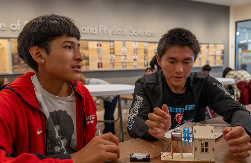 Two native american students working on an engineering project