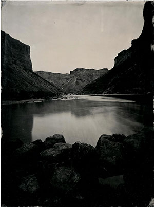 black and white photo of water in a canyon