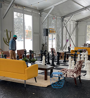 open room with couches and floor-sized chess set