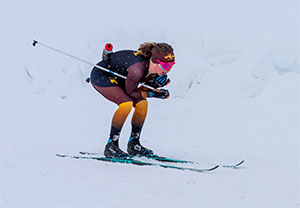 person crouched over skis, Nordic skiing