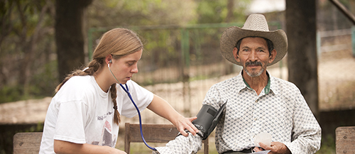 UW nursing student with resident of Agua Salada, Honduras