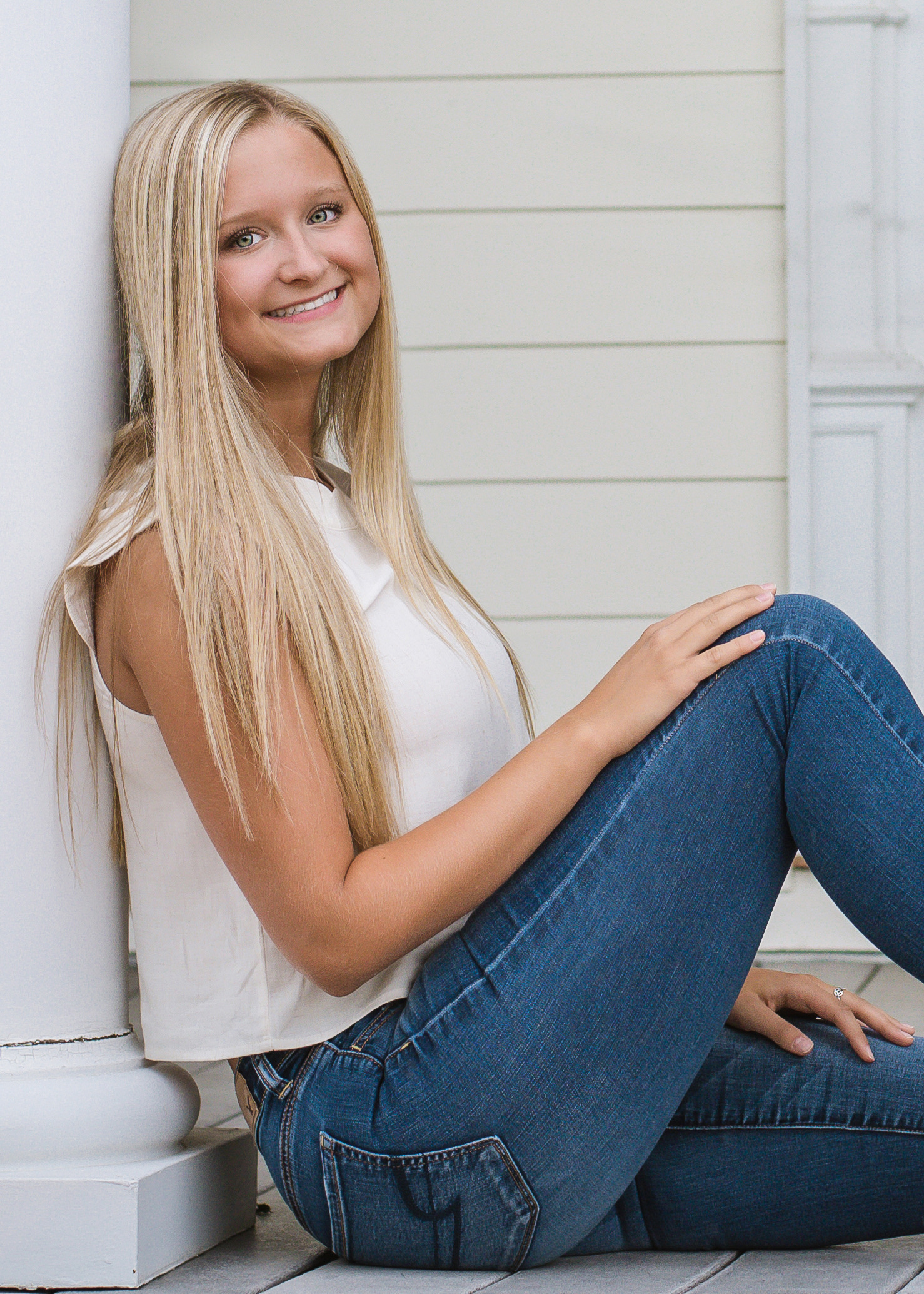 Female student sitting on porch