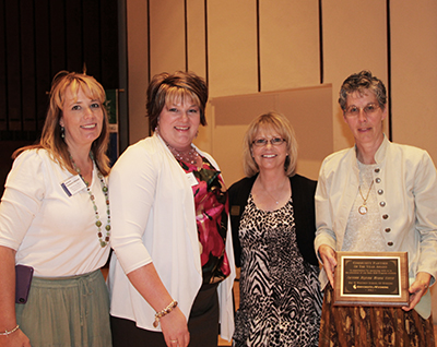 Cheyenne Regional Medical Center representatives accept the Community Partner of the Year 2012 award from University of Wyoming School of Nursing faculty and dean.