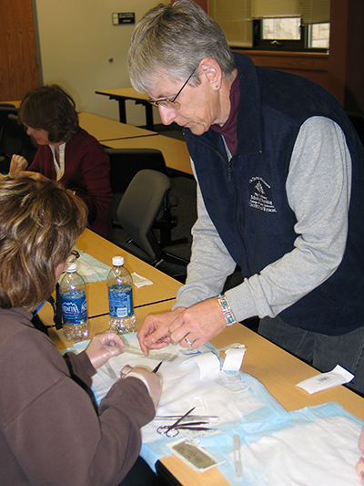 Ann Enlow, Nurse Practitioner at Cheyenne VAMC, provides a suturing workshop for UW NP students.