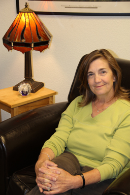 Carol Becker relaxes in her office at Peak Wellness Center in Laramie, WY