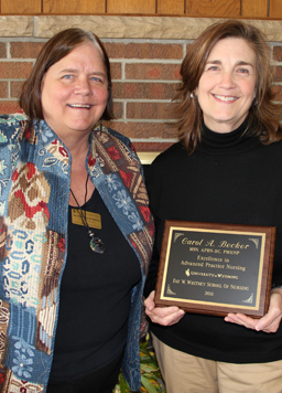 Dana Murphy-Parker, UW School of Nursing PMHNP Program Coordinator, congratulates Carol Becker on her receipt of the 2011 Excellence in Advanced Nursing Practice Award