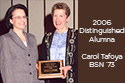 Picture of Carol Tafoya receiving Distinguished Alumna award from Dean Pamela Clarke