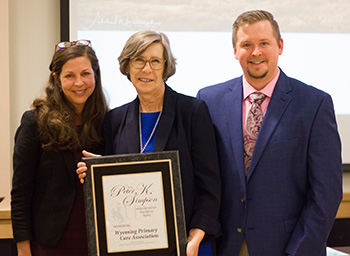 UW faculty present award to WPCA representatives