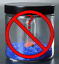 Photo of a chemical jar without a label crossed out by a large, Red X