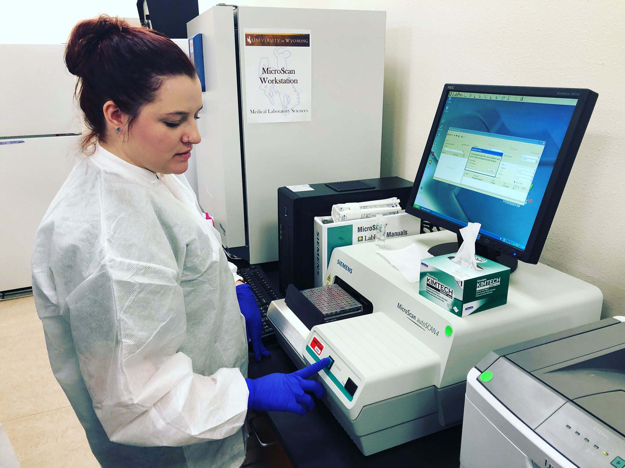 Female student using medical computer.