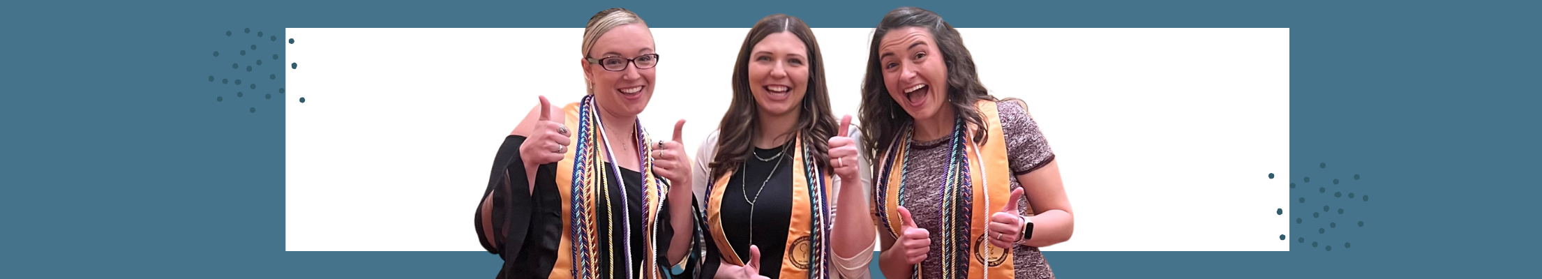 three students with cords thumbs up
