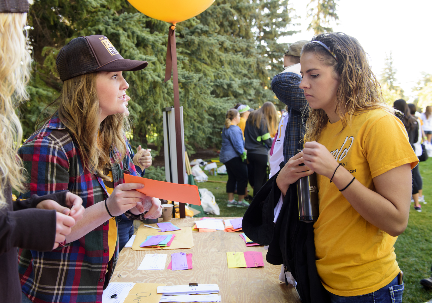Students talking during an outside college event.