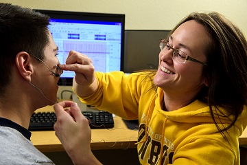 Graduate student uses facial EMG