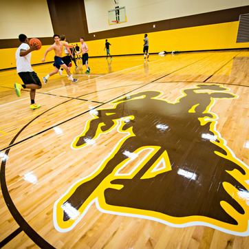 UW students play basketball in a campus recreation facility in the University of Wyoming gym