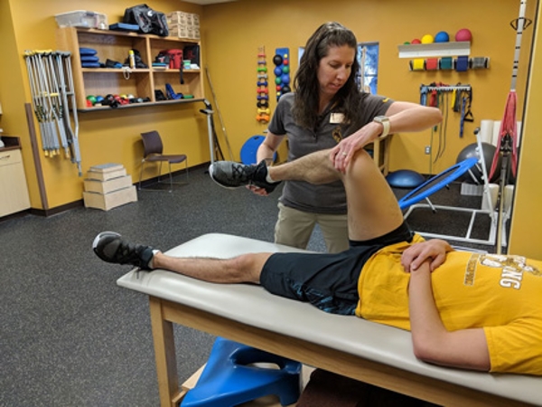 Athletic Trainer Helping A Student Athlete