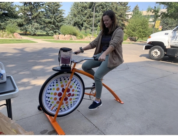 A student rides the Smoothie Bike