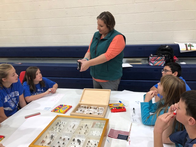 Rebecca teaching students about bugs