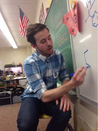 Tyler drawing on a whiteboard