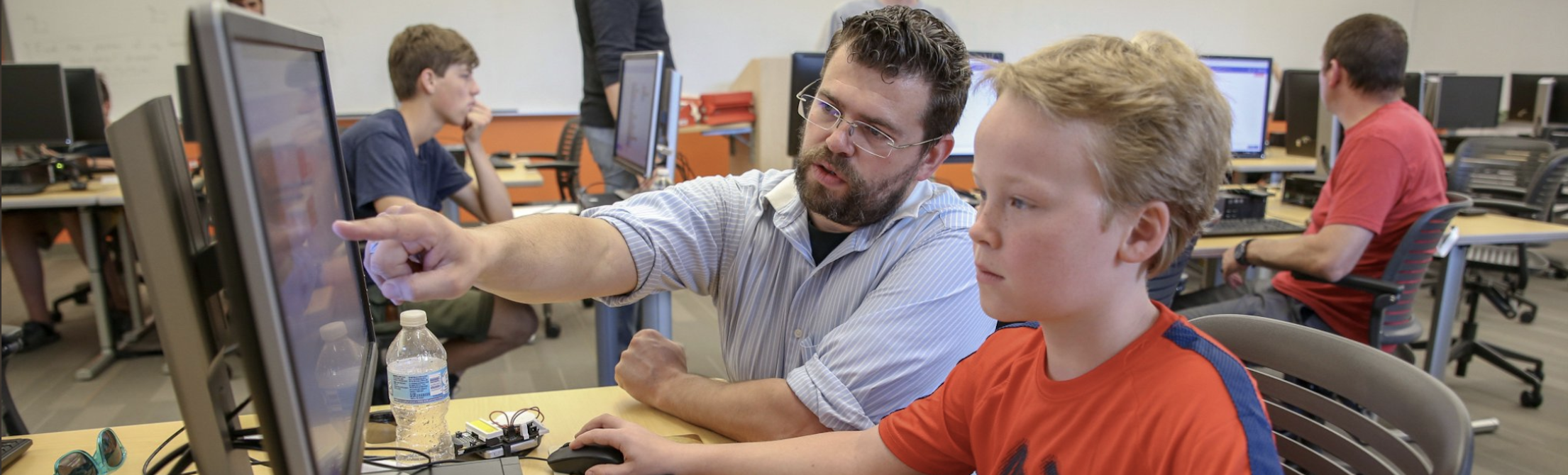 Dr. Borowczak helping a student at a computer