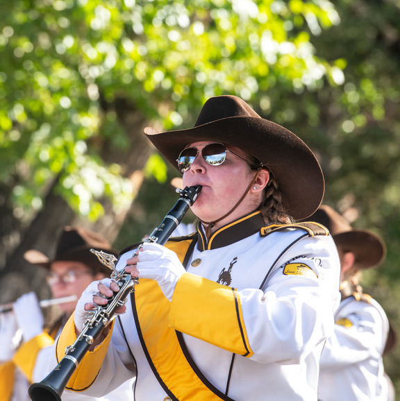 Student in Western Thunder Marching Band playing a clarinet. 