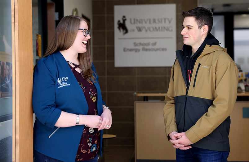 Academic Director speaking to a student outside the SER Academic Office