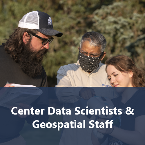 Three people examining and discussing spatial data