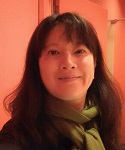 photograph of Dr. Yi-Ling Chen in front of an orange background