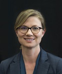 photograph of Dr. Zoe Pearson in front of a black background