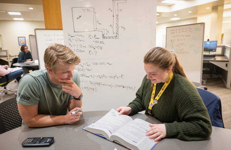 One STEP tutor helps a University of Wy student at the oming STEP Tutoring Center