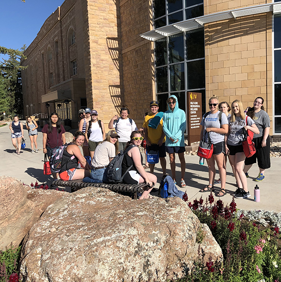 students wait for their bus during the 2019 Summer Bridge