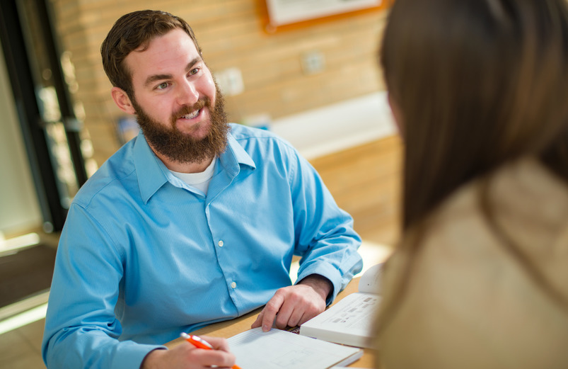 Advisor talking to student