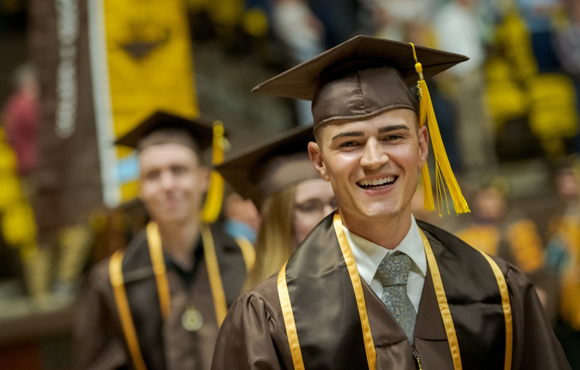 Student smiling during commencement