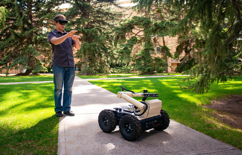 Student with robotic vehicle