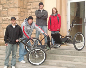 Students posing with bicycles