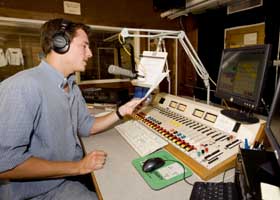 Man at radio station controls