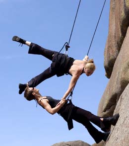 Two dancers performing on ropes