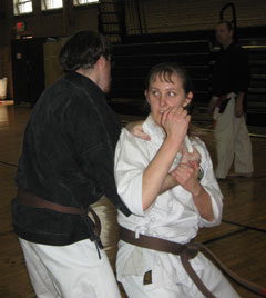 Man and woman practicing karate