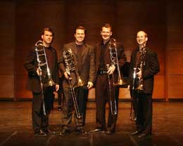 Four men with trombones