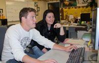 Two students working at computer
