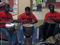 Three musicians playing drums