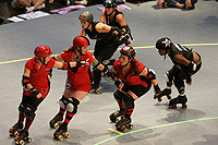 Roller derby team skating