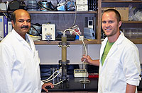 Professor and student working in lab