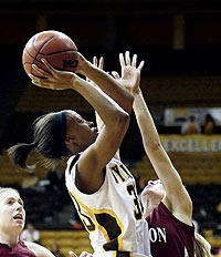 Chaundra Sewell shooting basketball