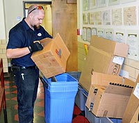 Man sorting boxes